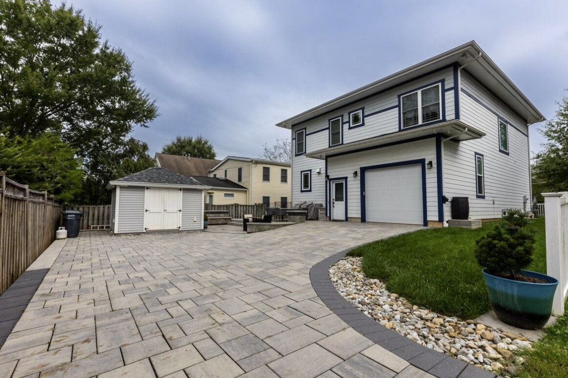 Large concrete paver pool deck and driveway surrounding a residential home in Camarillo, CA